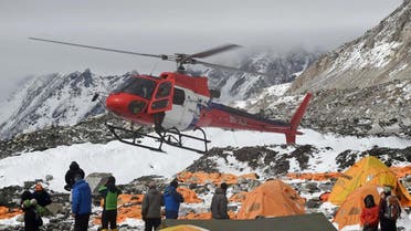 A rescue helicopter prepares to land and airlift the injured from Everest Base Camp on April 26, 2015. (File photo: AFP)