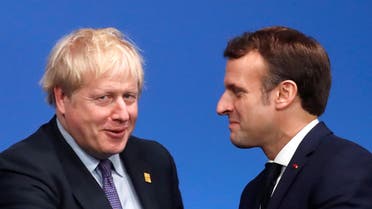 A file photo of Britain's Prime Minister Boris Johnson (L) and France's President Emmanuel Macron (R). (AFP) 