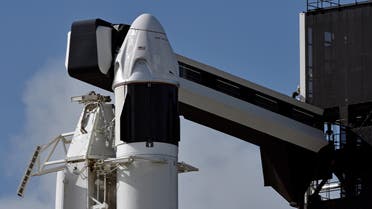 The SpaceX Crew Dragon capsule sits atop a Falcon 9 booster rocket on at Kennedy Space Center at Cape Canaveral. (File photo: AFP)