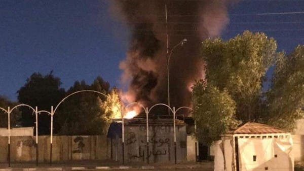 متظاهرون يحرقون مقراً لميليشيا حزب الله العراقي بالنجف