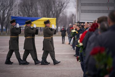 Soldiers carry a coffin of one of the eleven Ukrainian victims of the Ukraine International Airlines flight 752 plane disaster during a memorial ceremony outside Kiev. January 19, 2020. (File photo: Reuters)