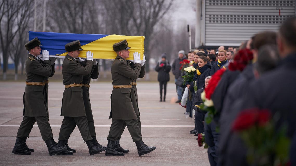 Soldiers carry a coffin of one of the eleven Ukrainian victims of the Ukraine International Airlines flight 752 plane disaster during a memorial ceremony outside Kiev. January 19, 2020. (File photo: Reuters)
