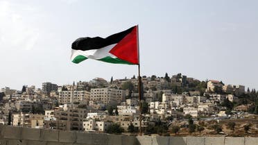 A Palestinian flag flies on the roof of an apartment in the Silwan neighborhood of east Jerusalem. (File photo: AP)
