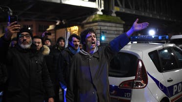 Protestors gesture next to a police car in front of the Bouffes du Nord theatre in Paris on January 17, 2020 against a pension reform. (File photo: AFP)