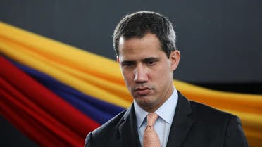 Venezuela's National Assembly President and opposition leader Juan Guaido, who many nations have recognised as the country's rightful interim ruler, attends a session of Venezuela's National Assembly taking place in an amphitheatre in Caracas. (AFP)