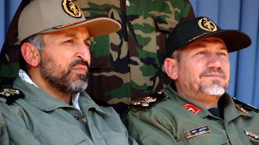 Head of the Islamic Revolutionary Guards, Gen. Rahim Safavi, right, and head of paramilitary Basiji forces Gen. Mohammad Hejazi, attend in a rally by 100,000 paramilitary forces in the southern suburbs of Tehran on Wednesday Nov. 24, 2004. Gen. Rahim Safavi, warned the U.S. of any possible attack against Iran saying America's interests and security will be endangered if Washington takes any military action against Iran. (AP Photo/Hasan Sarbakhshian)