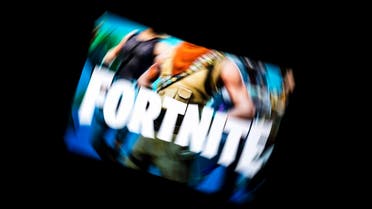 This illustration picture shows the video game Fortnite logo displayed on a tablet in Paris, on February 18, 2019. (AFP)