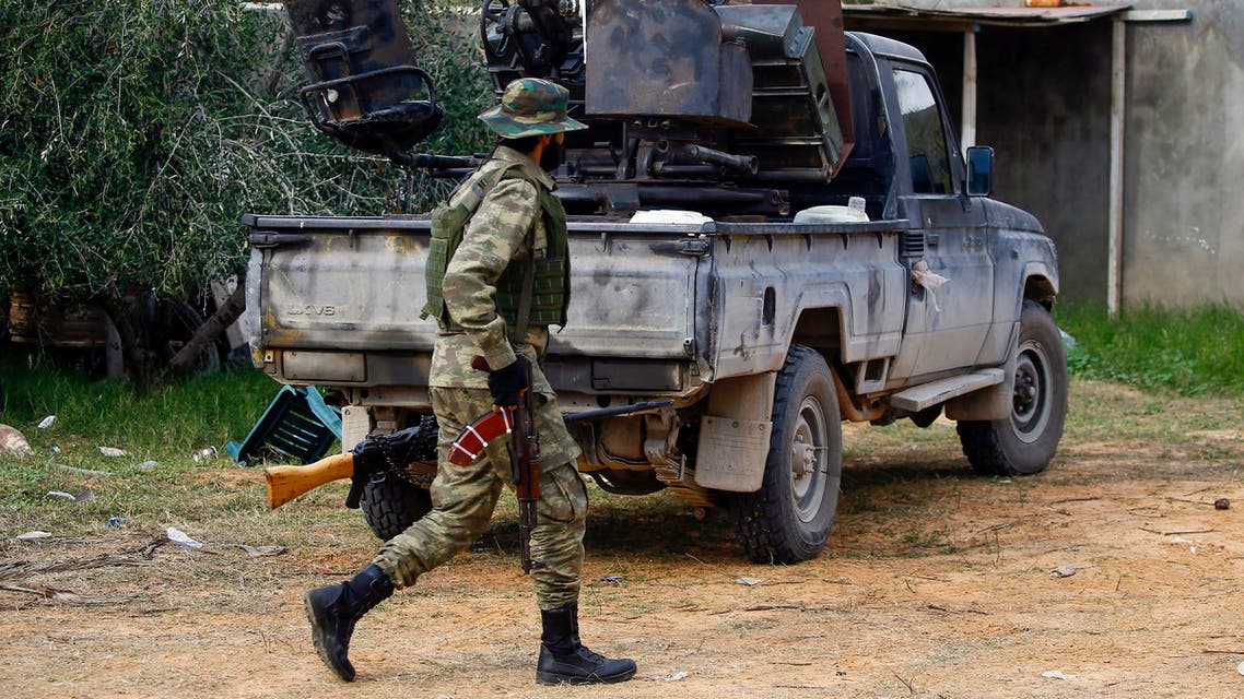 Fighters loyal to the internationally recognised Libyan Government of National Accord (GNA) patrol an area south of the Libyan capital Tripoli on January 12, 2020. Both sides in Libya's conflict agreed to a ceasefire to end nine months of fighting, following weeks of international diplomacy and calls for a truce by power-brokers Russia and Turkey. The UN-recognised Government of National Accord (GNA) in Tripoli had been under attack since last April from forces loyal to eastern-based strongman Khalifa Haftar, which on January 6 captured the strategic coastal city of Sirte.