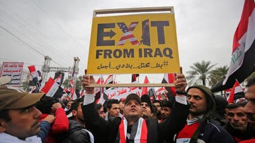 Protesters raise a placard as supporters of Iraqi cleric Moqtada Sadr gather in the capital Baghdad for a "million-strong" march to demand an end to the presence of US forces in their country. (AFP)