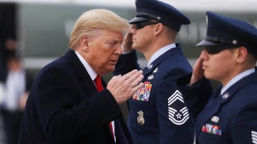 US President Donald Trump salutes US Air Force personnel as he boards Air Force One to depart for travel to Florida at Joint Base Andrews. (Reuters)