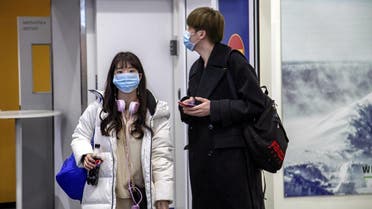 Air travellers wear masks as they arrive at Ivalo Airport, Finland on January 24, 2020. (Reuters)