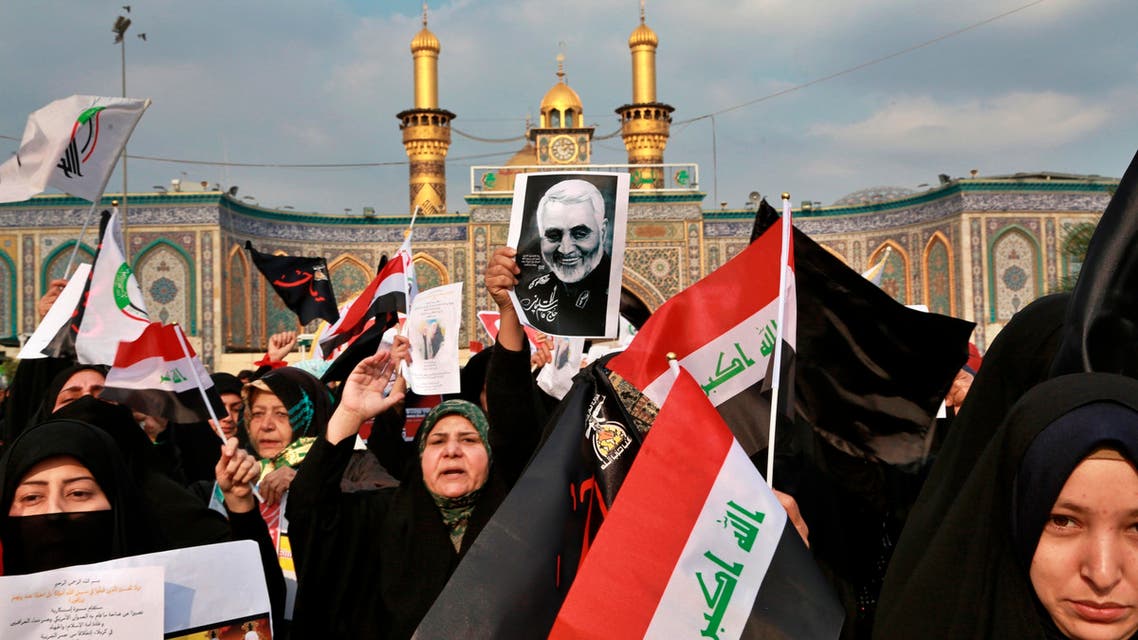 Shiite Muslims demonstrate over the U.S. airstrike that killed Iranian Revolutionary Guard Gen. Qassem Soleimani, in the posters, in Karbala on Jan. 4, 2020.. (AP)