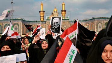 Shiite Muslims demonstrate over the U.S. airstrike that killed Iranian Revolutionary Guard Gen. Qassem Soleimani, in the posters, in Karbala on Jan. 4, 2020.. (AP)