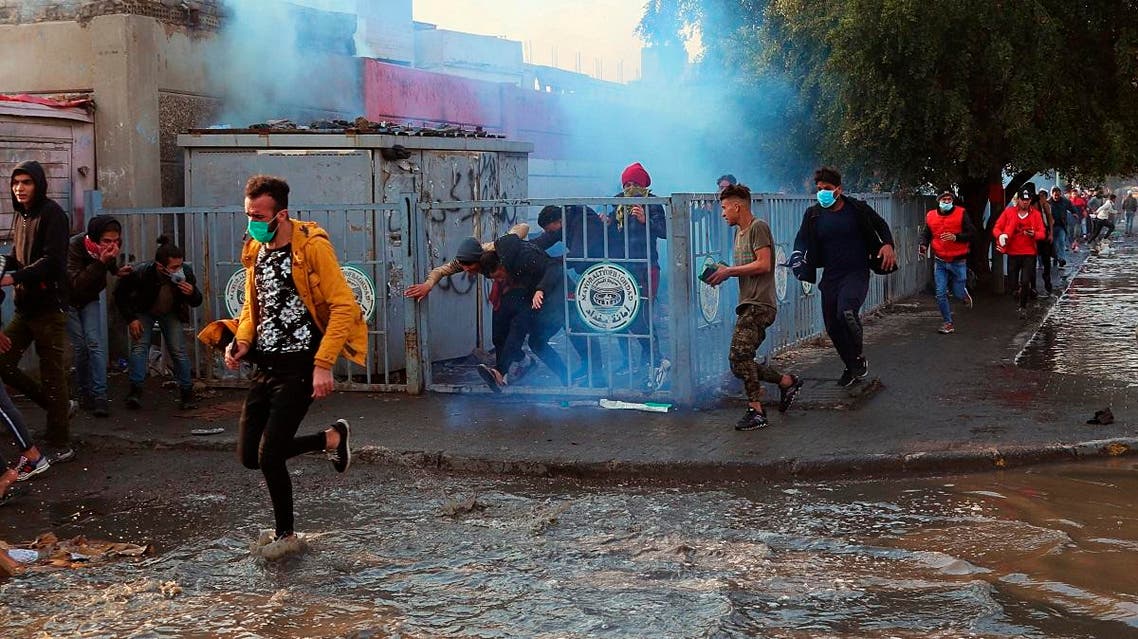 Smoke rise from tear gas fired by security forces during clashes with anti-government protesters in Baghdad, Iraq. (Reuters)
