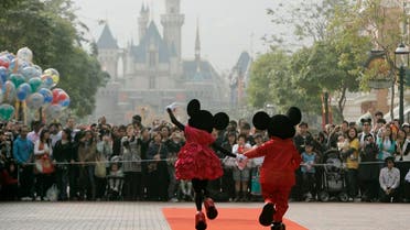 People dressed as cartoon characters Mickey and Minnie greet visitors with their latest Year of the Mouse costumes at Hong Kong Disneyland January 21, 2008. (Photo: Reuters)