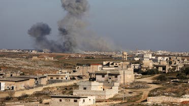 Smoke billows above building during recent air strikes by pro-regime forces in the jihadist-held city of Maaret al-Numan in Syria's northwestern Idlib province, on January 25, 2020. Regime forces, backed by Russian warplanes, have increased their attacks on southern Idlib since December, displacing more than 358,000 people, according to the United Nations.