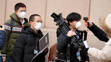 Members of the media have their temperature checked before attending a news conference by the State Council Information Office about the outbreak of the new coronavirus in Beijing, China, January 26, 2020. (Photo: Reuters)
