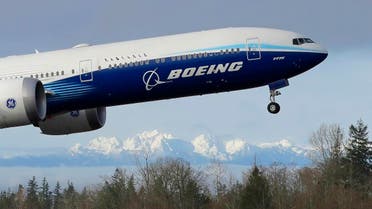 A Boeing 777X airplane takes off on its first flight with the Olympic Mountains in the background at Paine Field, Saturday, Jan. 25, 2020, in Everett, Wash. (AP)