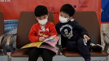 Passengers wear masks to prevent an outbreak of a new coronavirus in the high speed train station, in Hong Kong. (AP)
