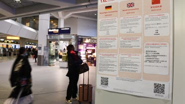 A poster with information about the coronavirus (2019-nCoV) is displayed at Tegel Airport in Berlin, Germany, January 26, 2020. REUTERS/Annegret Hilse