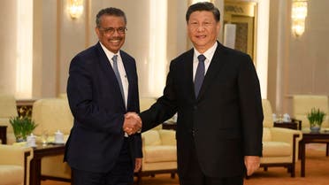 World Health Organization director general Tedros Adhanom (L) shakes hands with Chinese President Xi jinping before a meeting at the Great Hall of the People in Beijing on January 28, 2020. (AFP)