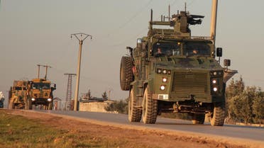 A convoy of Turkish military vehicles drives towards an observation point near the town of Atareb in Syria's northwestern Aleppo province on January 22, 2020. (AFP)