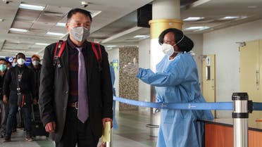 Passengers arriving from a China Southern Airlines flight from Changsha in China are screened for the new type of coronavirus, upon their arrival in Nairobi, Kenya on Jan. 29, 2020. (AP)