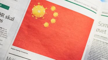 Cartoon of coronavirus depicted as part of Chinese national flag, is pictured in Danish newspaper Jyllands-Posten's edition in Copenhagen. (Reuters)