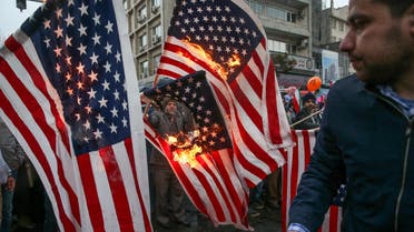 Iranians burning US flags (Reuters)