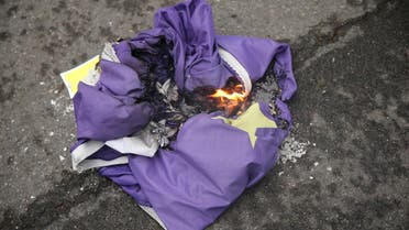 Brexit supporters burn an EU flag in Parliament Square in London on January 31, 2020 on the day that the UK formally leaves the EU. (AFP)
