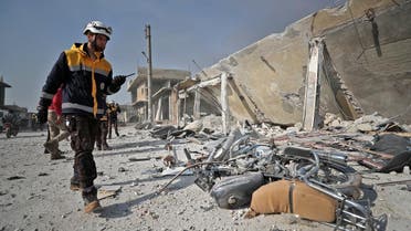Members of the Syrian Civil Defense, also known as the White Helmets, inspect the scene following a reported Russian air strike in the town of Saraqib in the northwestern Idlib province. (File photo: AFP)