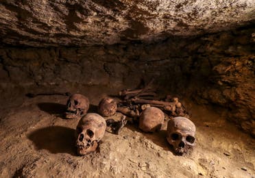 Skulls and human remains, among many archeological finds discovered in 3000-year-old communal tombs dedicated to high priests. (AFP)