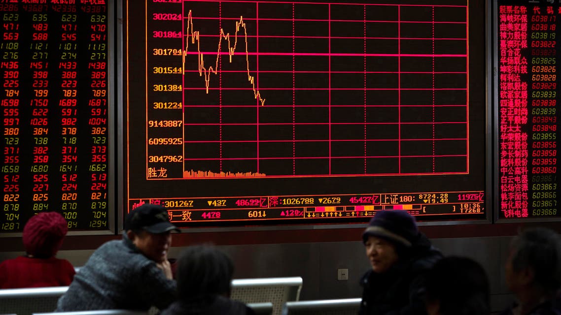 Chinese investors check stock prices at a brokerage house in Beijing. (AP)
