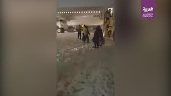 Passenger plane skids off snowy runaway in Iran