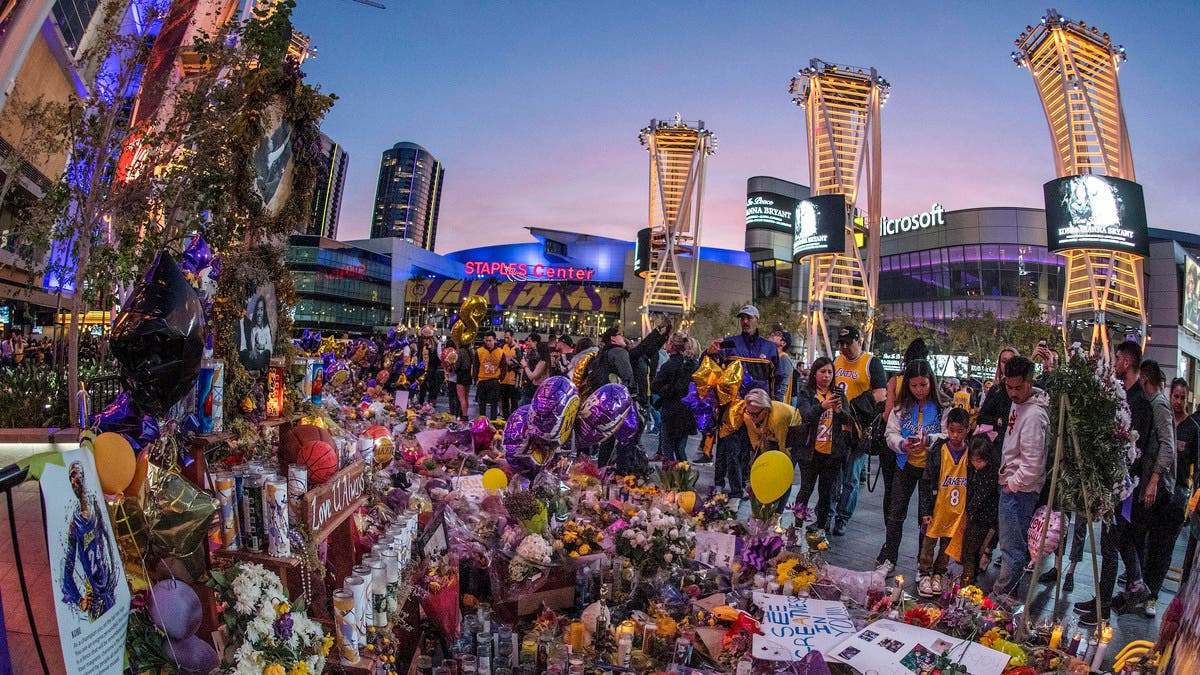 Fans gather outside Staples Center before Kobe Bryant of the Los