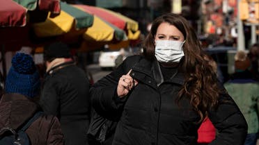 A woman, who declined to give her name, wears a mask, on January 30, 2020, in New York. (AP)