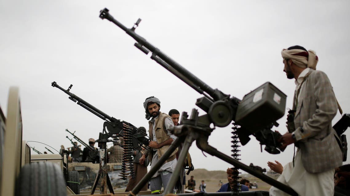 Houthi rebel fighters ride on trucks mounted with weapons, during a gathering aimed at mobilizing more fighters for the Houthi movement, in Sanaa (AP)