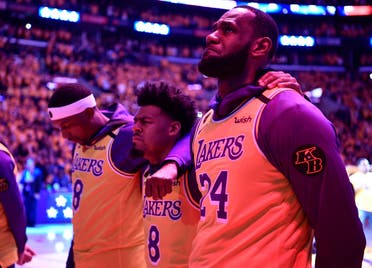 Los Angeles Lakers forward LeBron James reacts during the national anthem after a pre game tribute to Kobe Bryant before playing the Portland Trail Blazers at Staples Center. (Reuters)