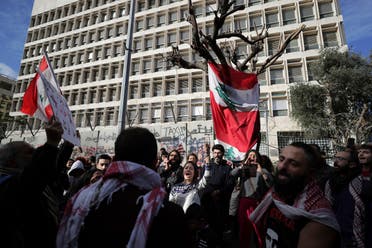 Anti-government protesters chant slogans, during ongoing protests against the Lebanese government in front of the Central Bank, in Beirut, Lebanon, Saturday, Feb. 1, 2020. (AP)