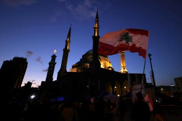 Anti-government protesters wave Lebanese flags and chant slogans, during ongoing protests against the Lebanese government, in Beirut, Lebanon, Saturday, Feb. 1, 2020.(File photo: AP)
