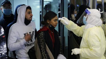 Passengers coming from China wearing masks to prevent a new coronavirus are checked by Saudi Health Ministry employees upon their arrival at King Khalid International Airport, in Riyadh, Saudi Arabia January 29, 2020. (Photo: Reuters)