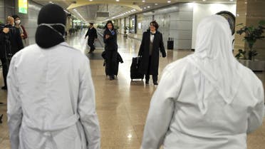 مطار القاهرة الدولي فحص حراري للمسافرين خوفا من انتشار كورونا- فرانس برس