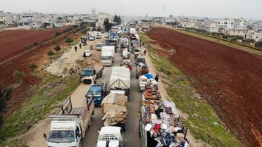 displaced Syrians driving through Hazano in the northern countryside of Idlib, after fleeing on January 28, 2020 its southern countryside towards areas further north near the border with Turkey. afp