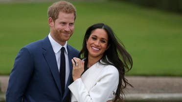  In this file photo taken on on November 27, 2017, Britain's Prince Harry stands with his fiancee US actress Meghan Markle as she shows off her engagement ring. (Photo: AFP)