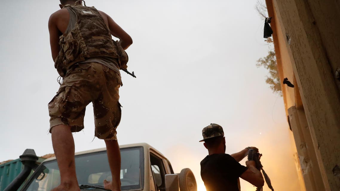 Fighters loyal to Libya's U.N.-backed government (GNA) fire guns during clashes with forces loyal to Khalifa Haftar on the outskirts of Tripoli, Libya May 25, 2019. REUTERS/Goran Tomasevic