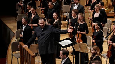 Andris Nelsons gestures towards the musicians prior to conducting a joint concert of the Boston Symphony Orchestra and Germany's visiting Leipzig Gewandhaus Orchestra at Symphony Hall in Boston. (AP)