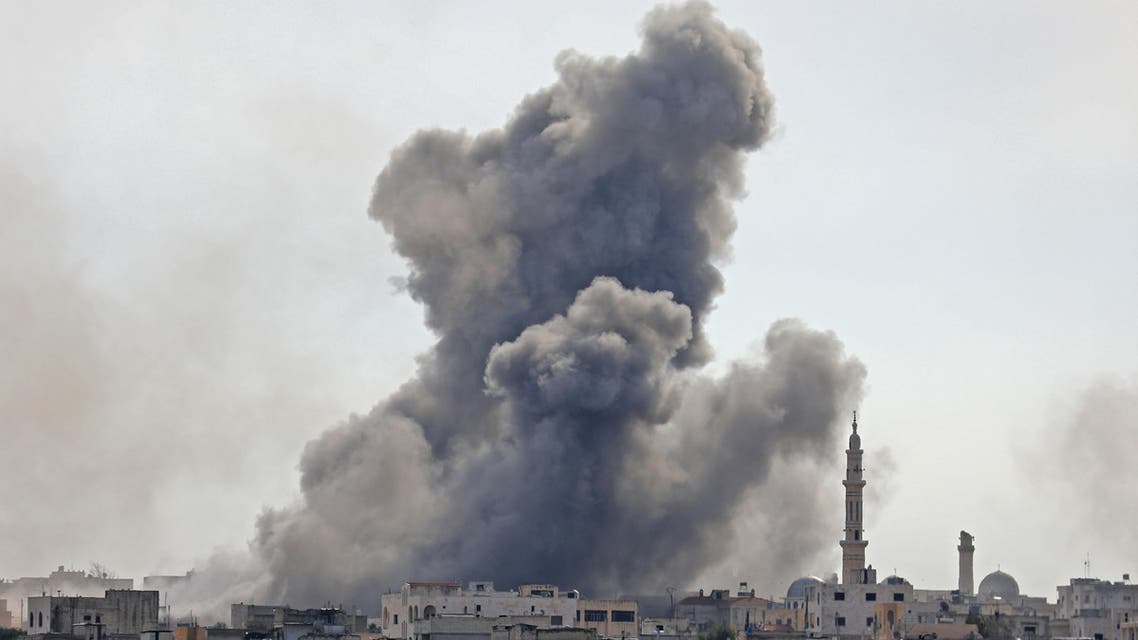 Smoke plumes billowing in the Syrian village of al-Nayrab, southeast of the city of Idlib. (AFP)