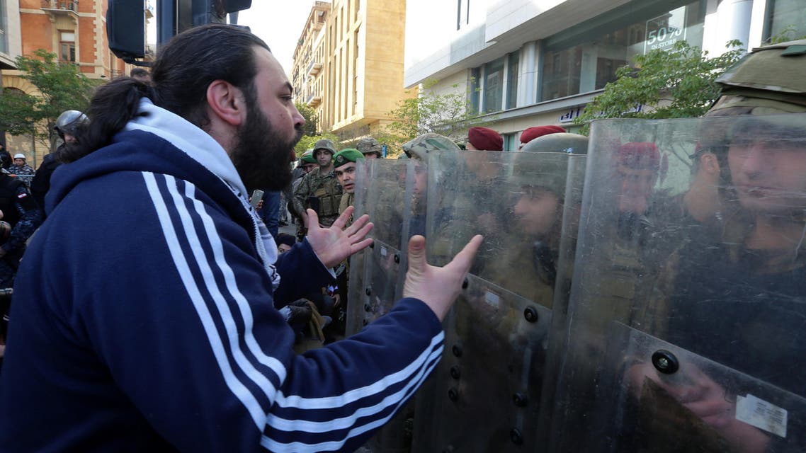 A protestor gestures at Lebanese soldiers during a protest against the political elite in Beirut, Lebanon January 27, 2020. (Reuters)