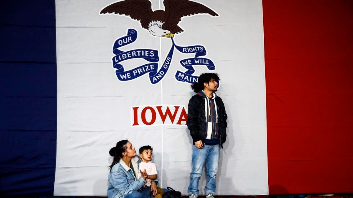 Natalie Serrano, left, and Isaac Garcia watch caucus returns come in with their son Leonel, 2, at a caucus night campaign rally in Des Moines, Iowa, Monday, Feb. 3, 2020. (Photo: AP)