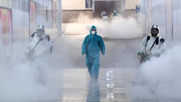 Volunteers in protective suits disinfect a railway station as the country is hit by an outbreak of the new coronavirus, in Changsha, Hunan province, China February 4, 2020. (Reuters)